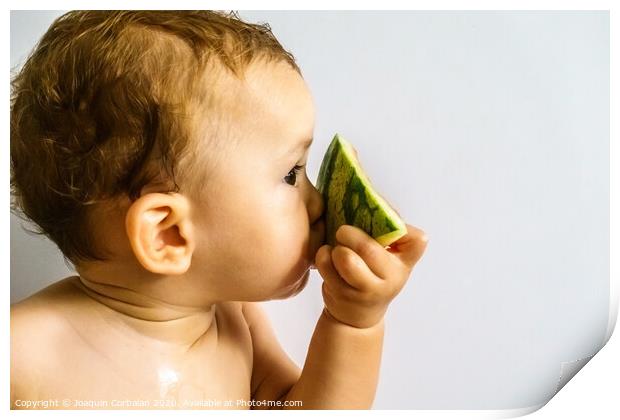 Baby in profile eating a watermelon drooling and getting dirty with the sticky juice of the fruit. Print by Joaquin Corbalan