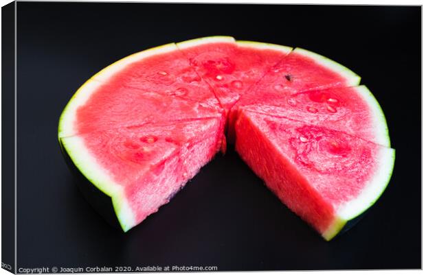 A large slice of watermelon divided into smaller pieces, flat, red, isolated on a black background, as a data chart. Canvas Print by Joaquin Corbalan