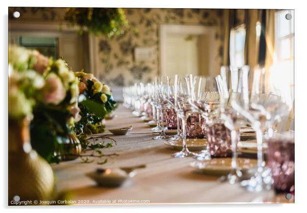 Elongated table with all the cutlery elegantly arranged and beautiful centerpieces ideal for decorating a wedding. Acrylic by Joaquin Corbalan