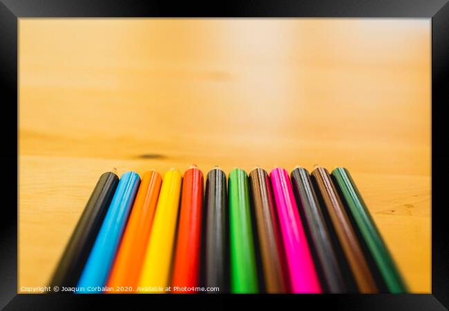 Colored pencils ordered to paint at school. Framed Print by Joaquin Corbalan