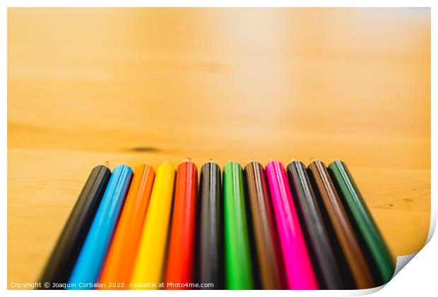 Colored pencils ordered to paint at school. Print by Joaquin Corbalan