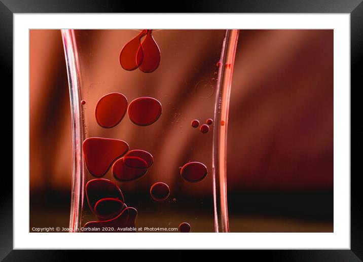 Red drops similar to blood falling in water. Framed Mounted Print by Joaquin Corbalan