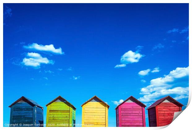 Colorful wooden changing huts on a beach, with nice background of clear blue sky on the coast. Print by Joaquin Corbalan