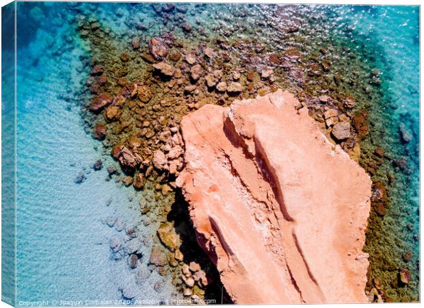 Transparent water Mediterranean coast with rocky bed, aerial view. Canvas Print by Joaquin Corbalan