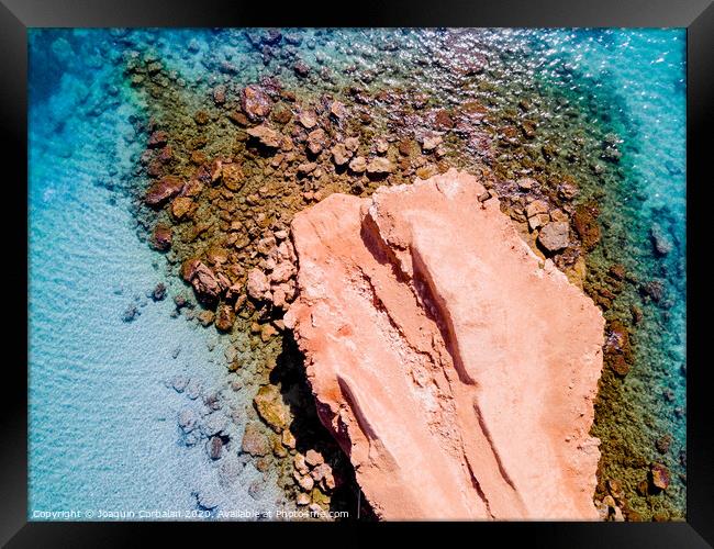 Transparent water Mediterranean coast with rocky bed, aerial view. Framed Print by Joaquin Corbalan