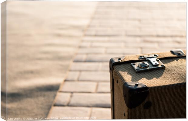 Close-up detail of an old vintage suitcase with blur background with copy space. Canvas Print by Joaquin Corbalan