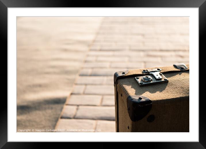 Close-up detail of an old vintage suitcase with blur background with copy space. Framed Mounted Print by Joaquin Corbalan