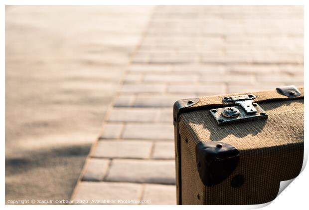 Close-up detail of an old vintage suitcase with blur background with copy space. Print by Joaquin Corbalan