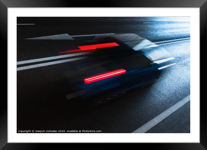 Car wake, swept, driving on fossil fuel on a dark city road. Framed Mounted Print by Joaquin Corbalan