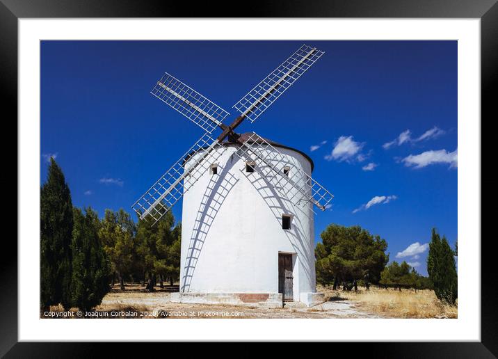 Traditional windmill of La Mancha, in Spain, protagonist of the famous novel Don Quixote. Framed Mounted Print by Joaquin Corbalan