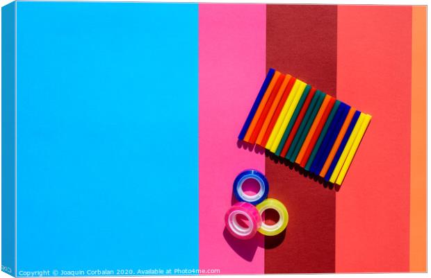 Colored background seen from above with plastic bars to use in crafts and stationery. Canvas Print by Joaquin Corbalan