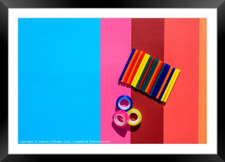 Colored background seen from above with plastic bars to use in crafts and stationery. Framed Mounted Print by Joaquin Corbalan