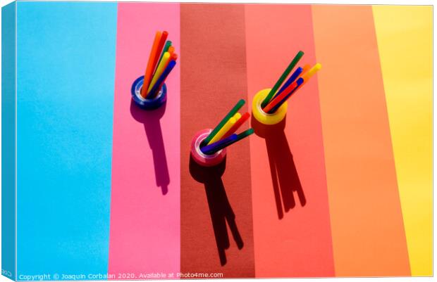 Plastic is a material for making recyclable colorful office supplies. Canvas Print by Joaquin Corbalan