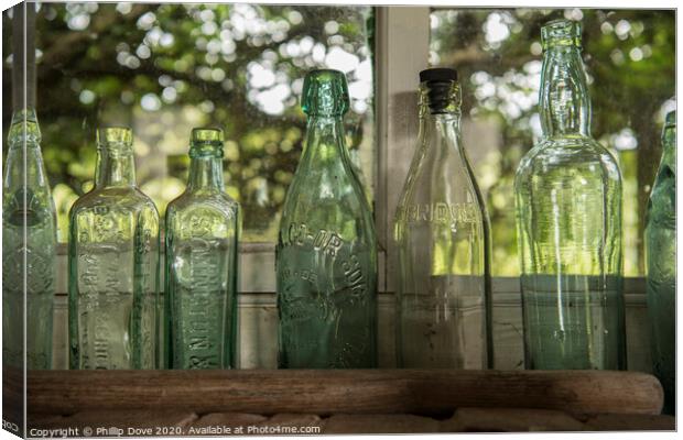 seven green bottles standing in a row Canvas Print by Phillip Dove LRPS