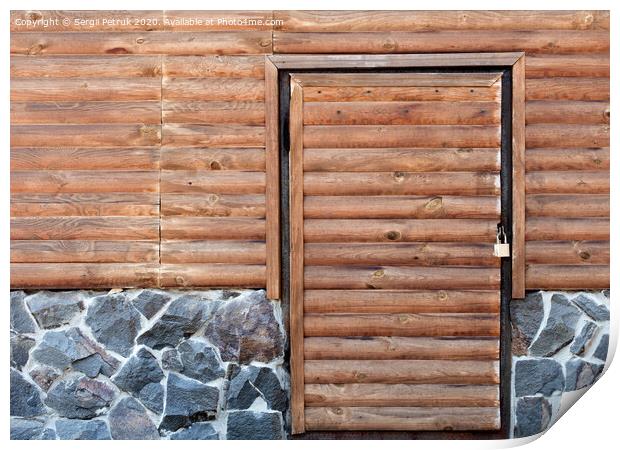 Wooden door to the utility room of a house standing on a stone foundation Print by Sergii Petruk