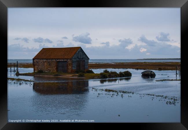 North Norfolk coal barn surrounded by sea Framed Print by Christopher Keeley