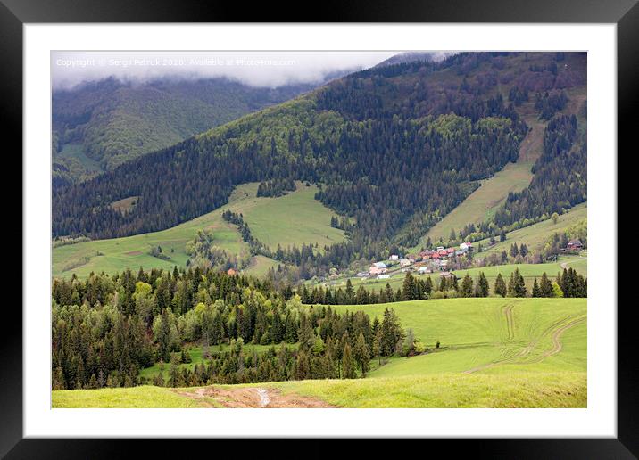Carpathians. Mountain landscape. Village in the valley among coniferous forests Framed Mounted Print by Sergii Petruk