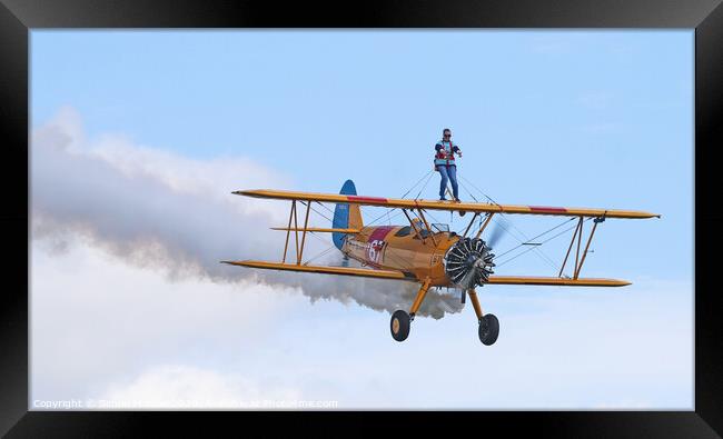 Wing Walking on a classic plane Framed Print by Simon Marlow