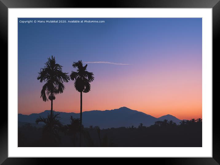 A tree with a mountain in the background Framed Mounted Print by Manu Mulakkal