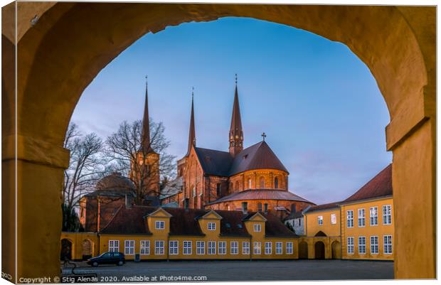 Roskilde cathedral in the soft evening light under the yellow portal of Roskilde Palace Canvas Print by Stig Alenäs
