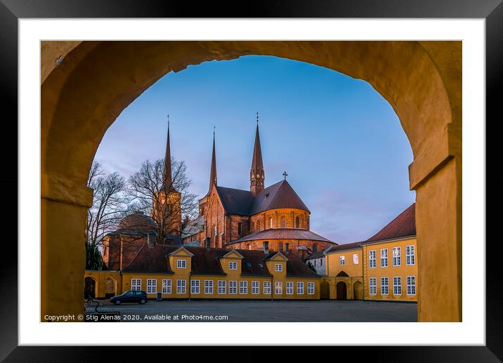 Roskilde cathedral in the soft evening light under the yellow portal of Roskilde Palace Framed Mounted Print by Stig Alenäs