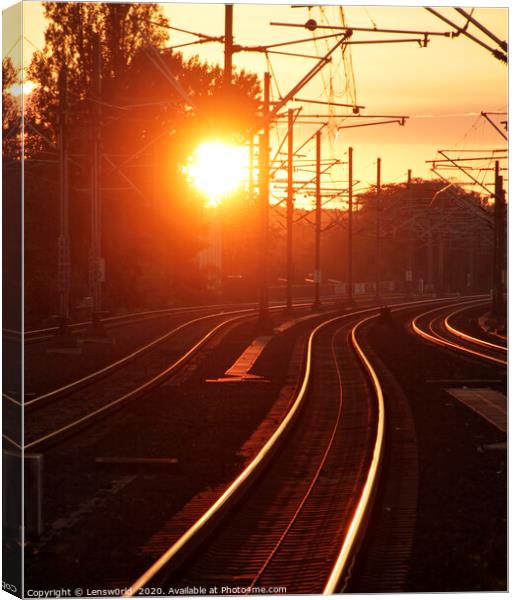 Sunset reflected on train tracks Canvas Print by Lensw0rld 
