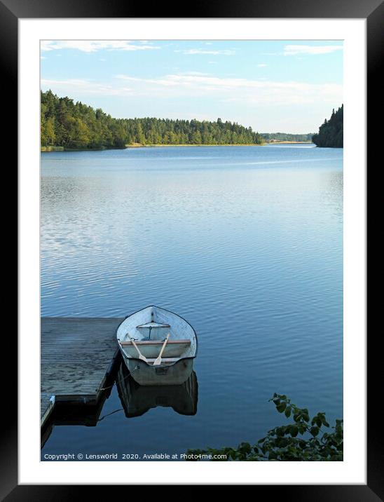 Calm lake with rowboat in Sweden Framed Mounted Print by Lensw0rld 