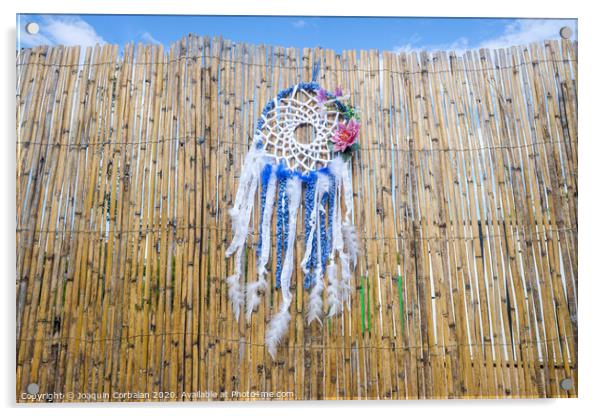 Vintage indigenous decoration hanging from a wall of old reeds, intense colors. Acrylic by Joaquin Corbalan