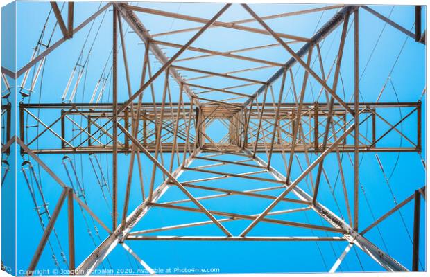 Electricity is transported by thick cables attached to metal towers. Canvas Print by Joaquin Corbalan
