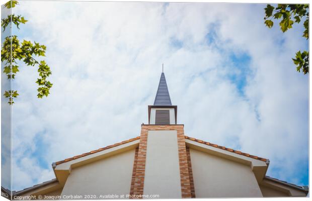 Facade of an evangelical church with smooth white walls and a cloudy sky background. Canvas Print by Joaquin Corbalan