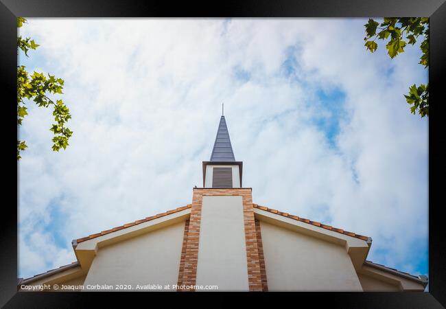 Facade of an evangelical church with smooth white walls and a cloudy sky background. Framed Print by Joaquin Corbalan