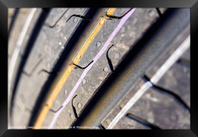Detail of the grooves of a new car tire. Framed Print by Joaquin Corbalan