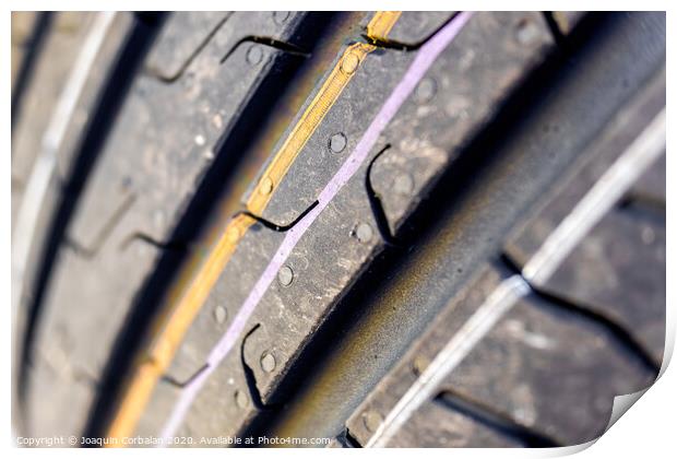 Detail of the grooves of a new car tire. Print by Joaquin Corbalan