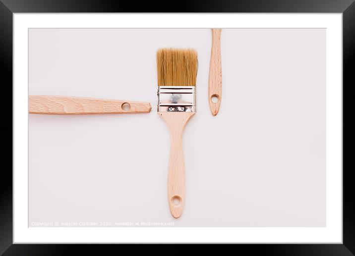 Simple background with new wooden paintbrushes isolated on white studio background. Framed Mounted Print by Joaquin Corbalan