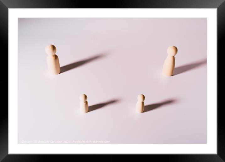 Representation of people keeping social distance, group of wooden figures on white background, Framed Mounted Print by Joaquin Corbalan