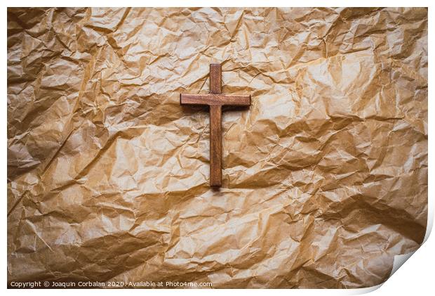 Simple wooden religious cross on brown paper background. Print by Joaquin Corbalan