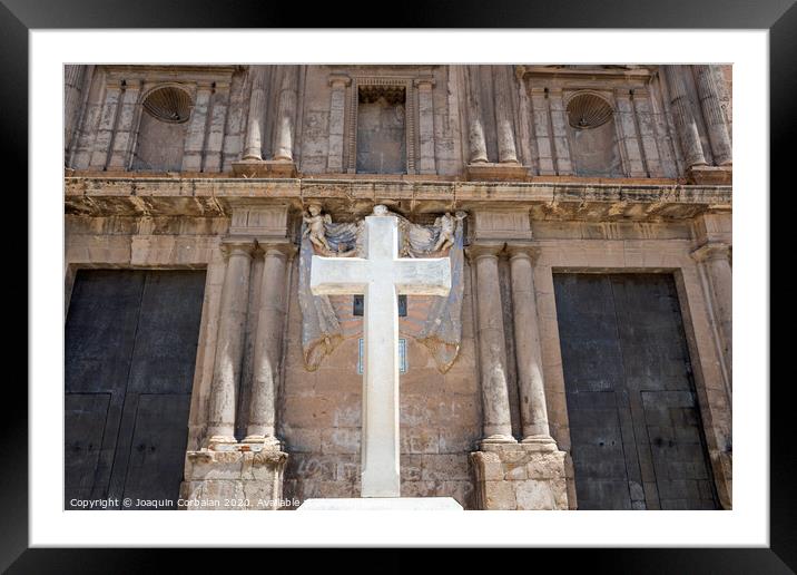 Cross carved in white stone, erected in front of a Christian religious church. Framed Mounted Print by Joaquin Corbalan