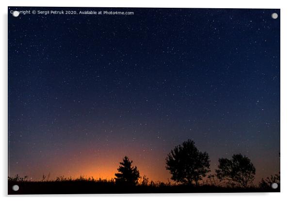 Silhouettes of three trees against the background of the night starry sky and the setting sun Acrylic by Sergii Petruk