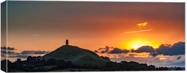 Silhouetted Sunrise at Glastonbury Tor Canvas Print by Andrew Sharpe