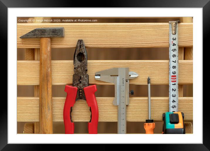 Old Construction tools on wooden slats close-up Framed Mounted Print by Sergii Petruk