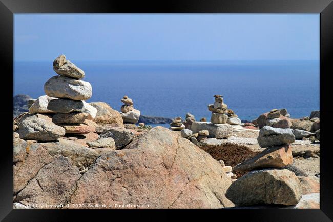 Stacked rocks at the coast of Mykonos Framed Print by Lensw0rld 