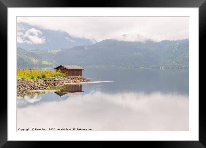 Wooden cabin in the shore of a fjord in Vorway Framed Mounted Print by Pere Sanz