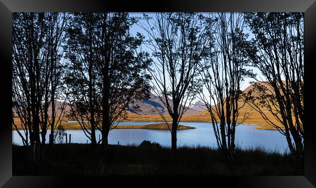 Silhouette trees over Lochan an Ais. Framed Print by Richard Morgan