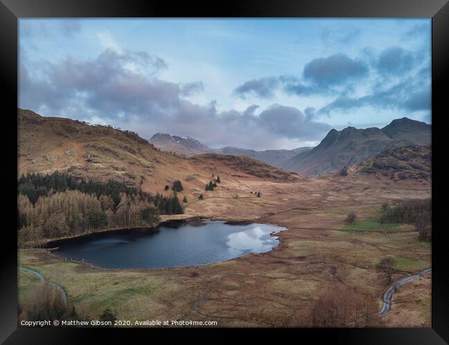 Beautiufl unique drone aerial sunrise landscape image of Blea Tarn and Langdales Range in UK Lake District Framed Print by Matthew Gibson