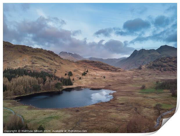 Beautiufl unique drone aerial sunrise landscape image of Blea Tarn and Langdales Range in UK Lake District Print by Matthew Gibson
