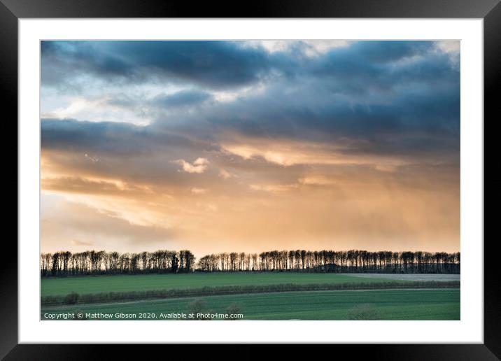 Beautiful stormy moody cloudy sky over English countryside landscape at dusk Framed Mounted Print by Matthew Gibson
