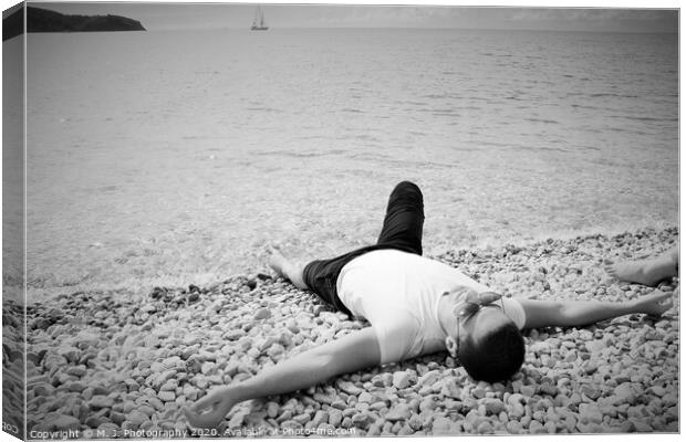 A person lying on a beach Canvas Print by M. J. Photography