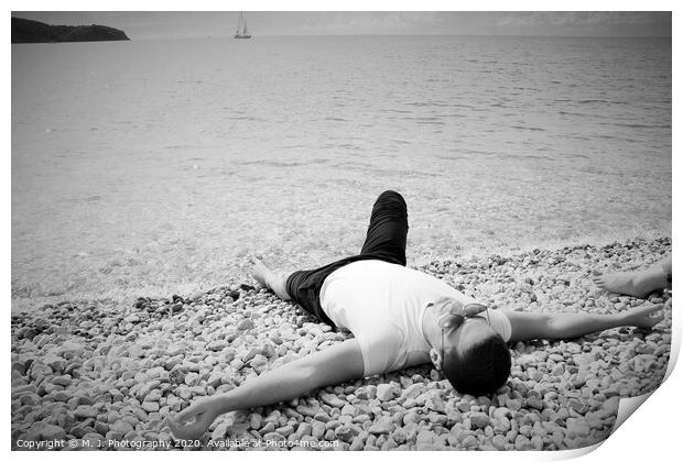 A person lying on a beach Print by M. J. Photography
