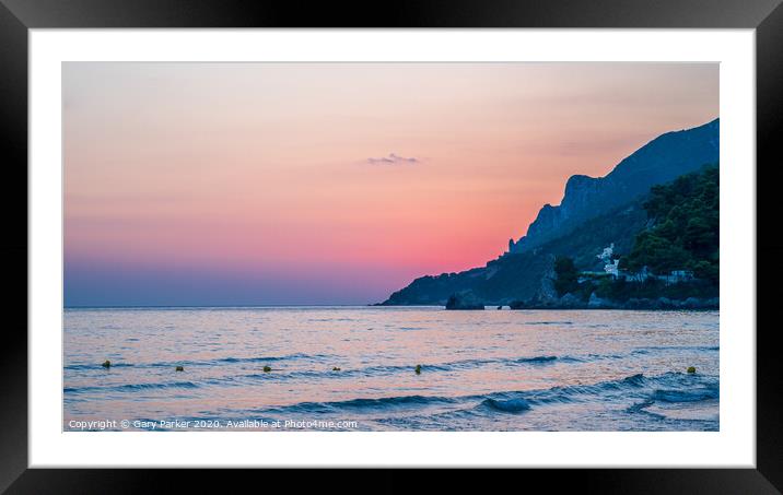 Sunset over a beach in Corfu, Greece	 Framed Mounted Print by Gary Parker