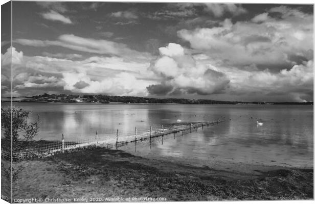 Cloudy skies over Rutland Water Canvas Print by Christopher Keeley